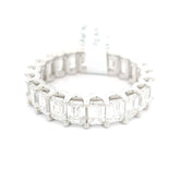 Luxurious anniversary style wedding band octagon-cut gemstones along with round-cut sparkling diamonds