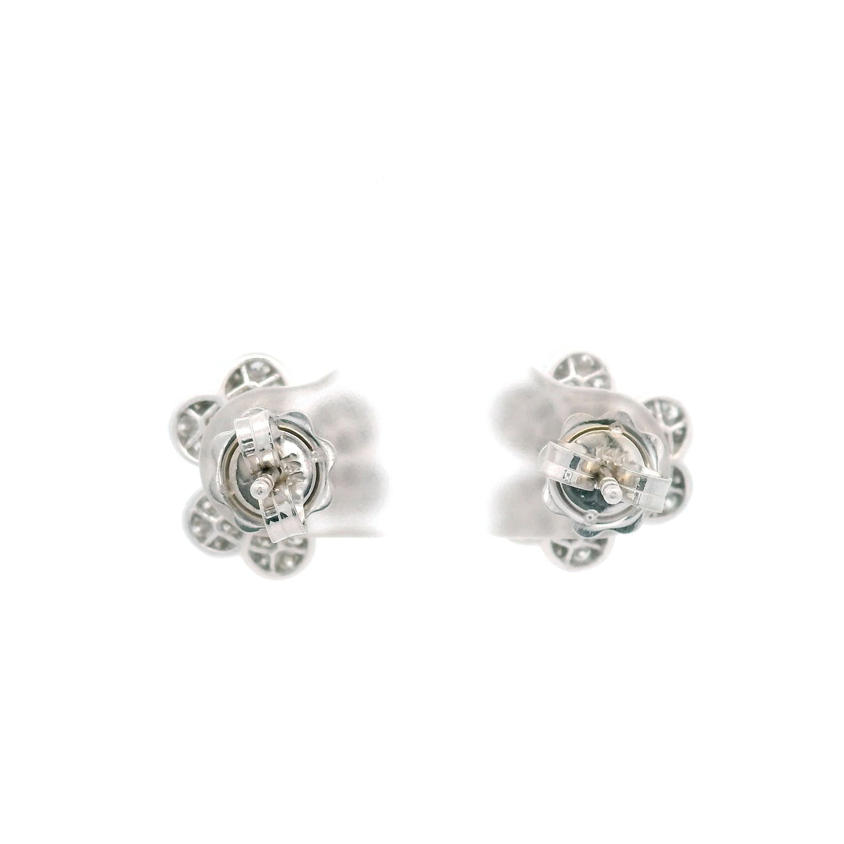 Clustres of round diamonds are set in 14k white gold to resemble two fully bloomed flowers